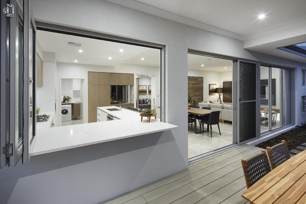 Carinya Select bifold door and window system opened to an outdoor living area